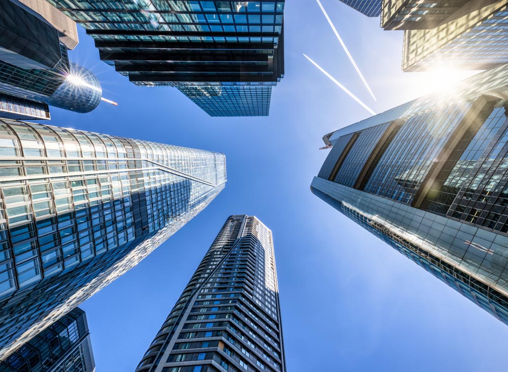 Looking up at highrise buildings