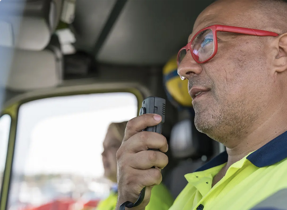 First responders in a truck on the radio