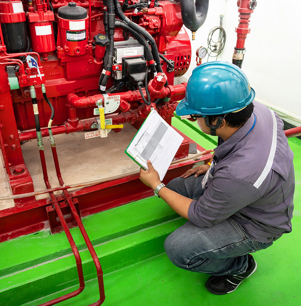 Engineer checking on an industrial fire control system