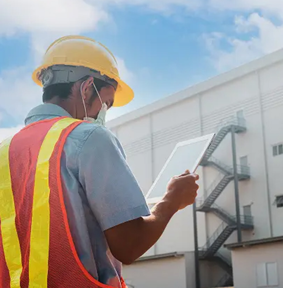 Employee testing an outdoor energy storage system